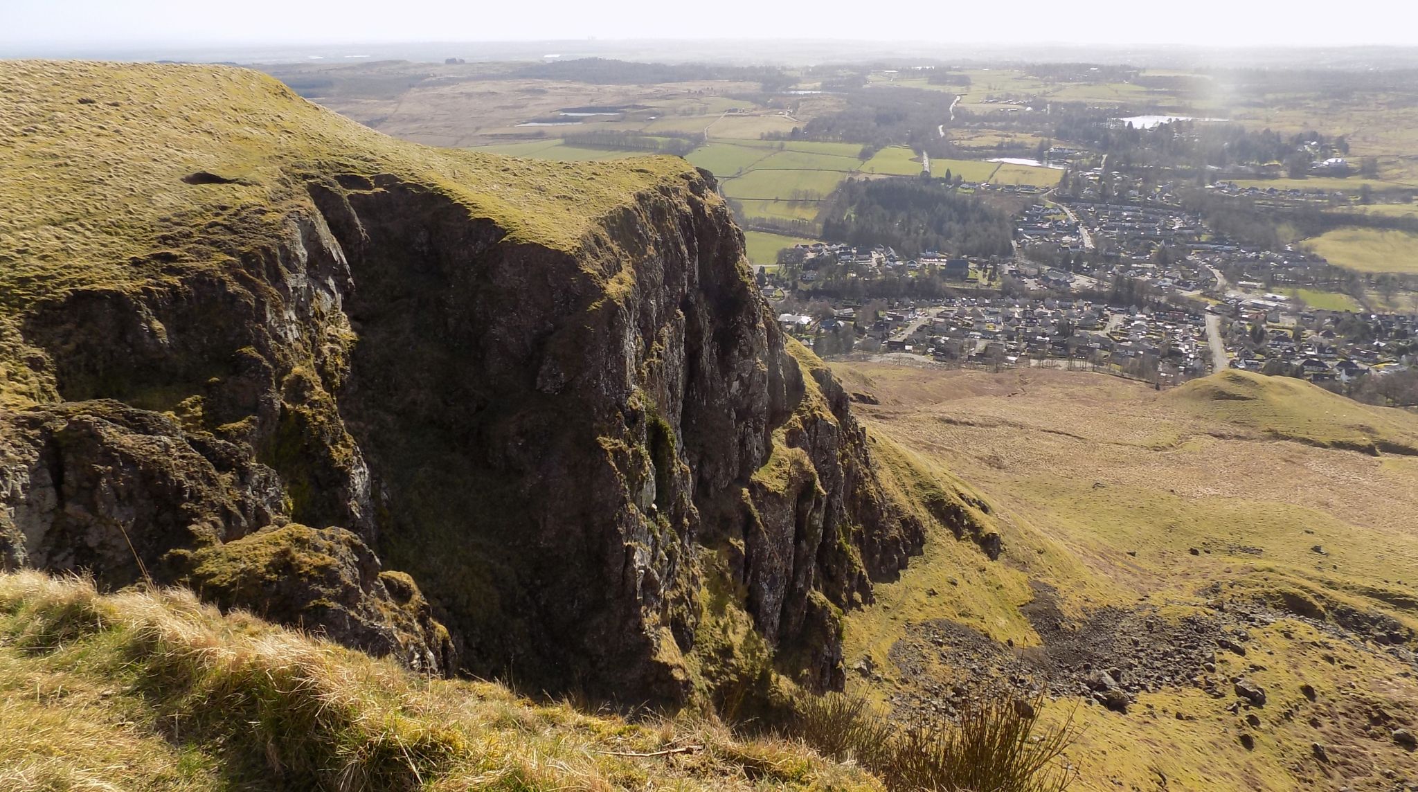 Strathblane beneath the Bannan Crags in the escarpment of the Campsie Fells